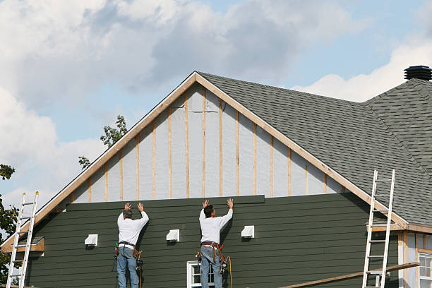 Professional Siding Replacement technician working in Winburne, PA